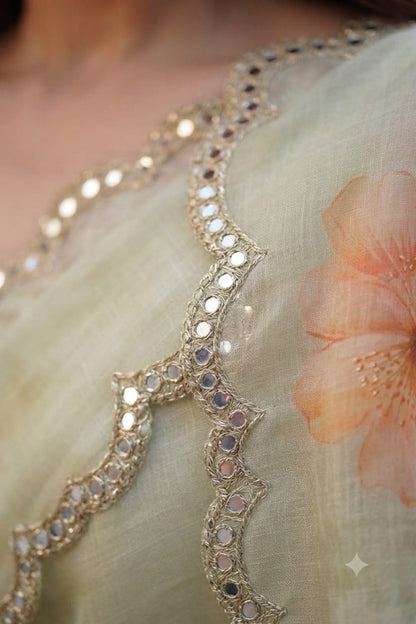Elegant Pastel Green Floral Organza Saree with Scalloped Mirror-Work Border