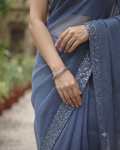 Timeless elegance in this blue striped linen saree.