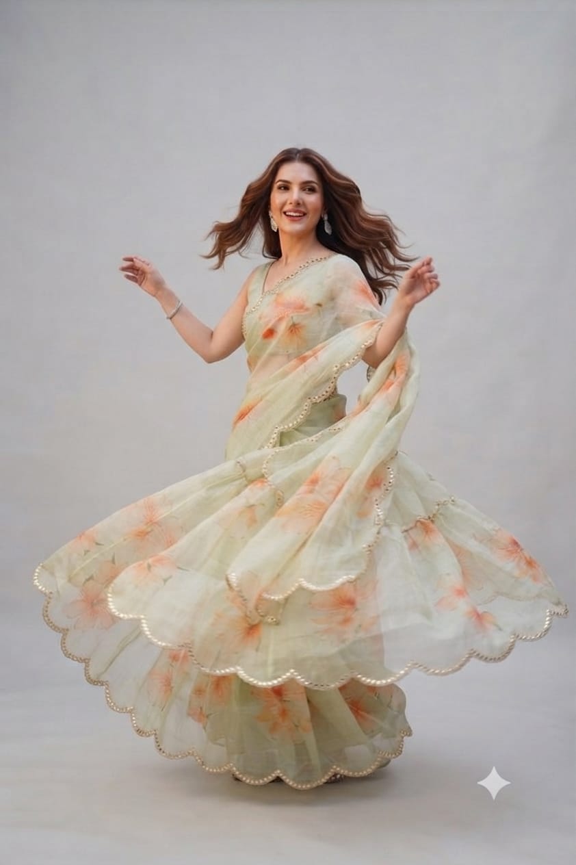 Elegant Pastel Green Floral Organza Saree with Scalloped Mirror-Work Border