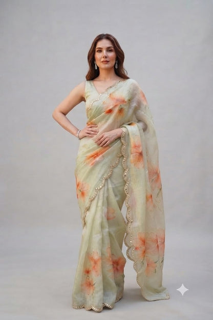 Elegant Pastel Green Floral Organza Saree with Scalloped Mirror-Work Border
