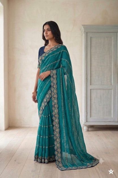Dark green synthetic saree with shining embroidery design