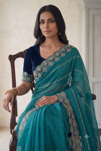 Dark green synthetic saree with shining embroidery design