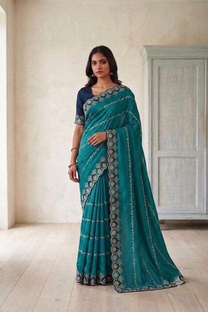 Dark green synthetic saree with shining embroidery design