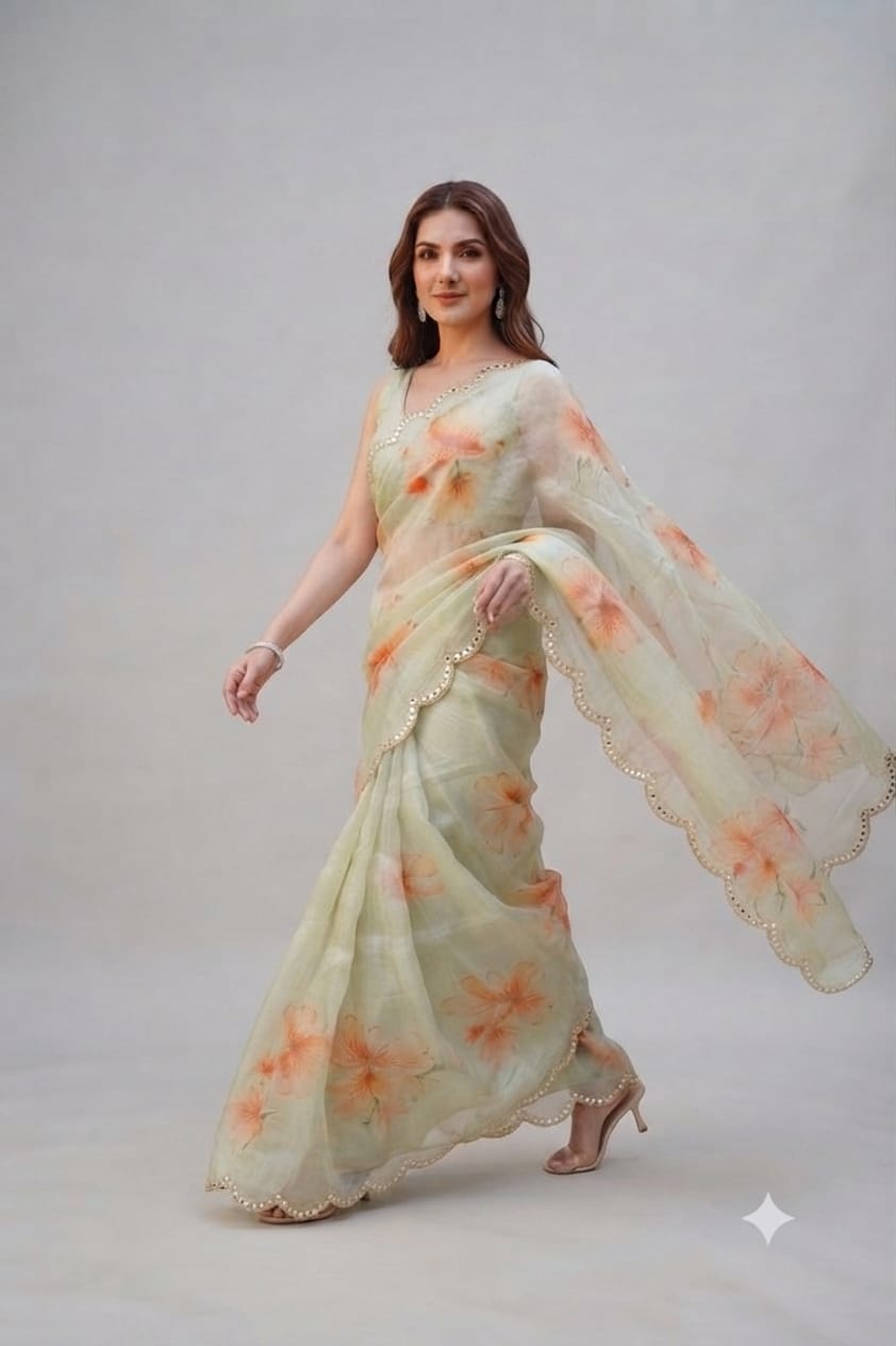Elegant Pastel Green Floral Organza Saree with Scalloped Mirror-Work Border