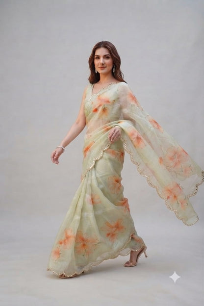 Elegant Pastel Green Floral Organza Saree with Scalloped Mirror-Work Border