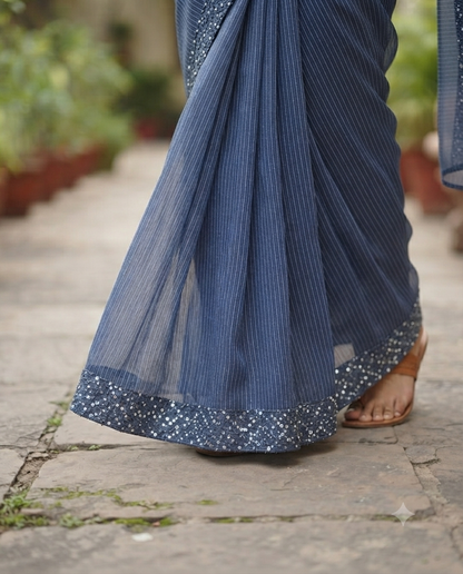 Timeless elegance in this blue striped linen saree.
