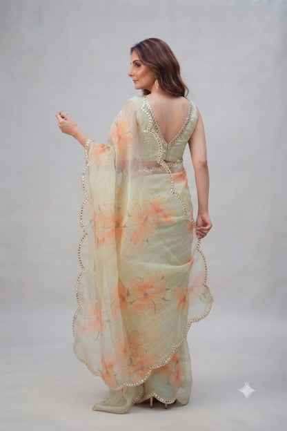 Elegant Pastel Green Floral Organza Saree with Scalloped Mirror-Work Border