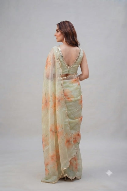 Elegant Pastel Green Floral Organza Saree with Scalloped Mirror-Work Border
