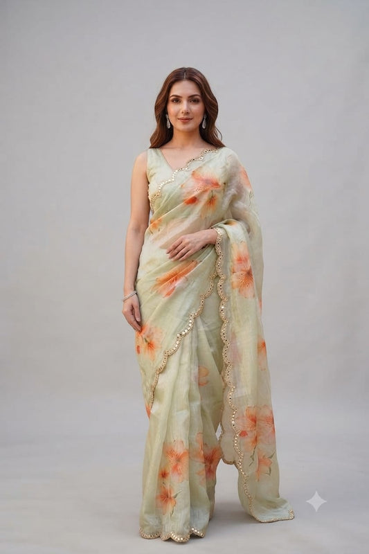 Elegant Pastel Green Floral Organza Saree with Scalloped Mirror-Work Border