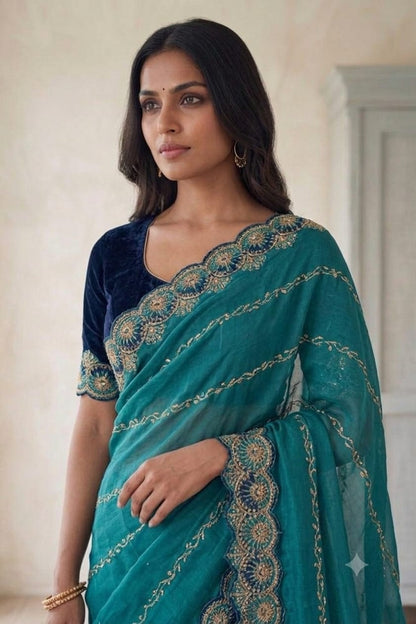 Dark green synthetic saree with shining embroidery design