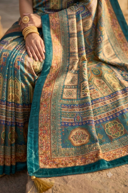 Elegant teal multicolour printed saree with velvet border and tassels